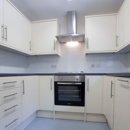 View of kitchen white cabinetry
