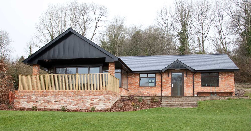 Front view of brick clubhouse with decking